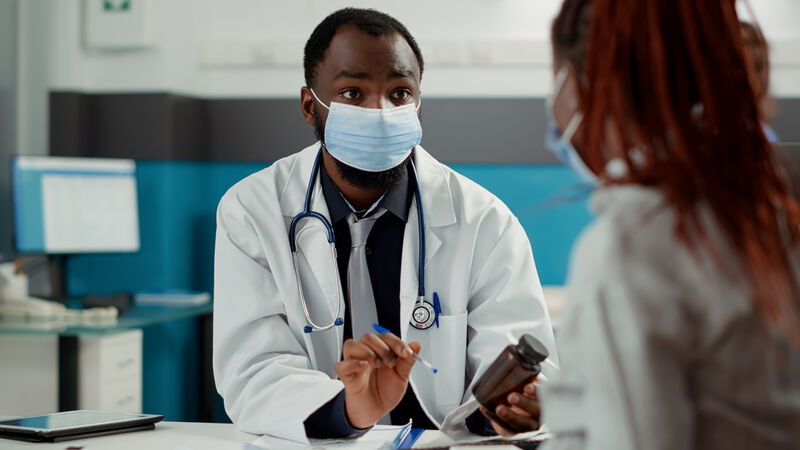 Doctor consulting with patient